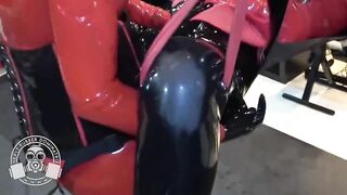 Red Rubber Doll Gets Pegged in Sling - Lady Bellatrix in latex catsuit with strapon